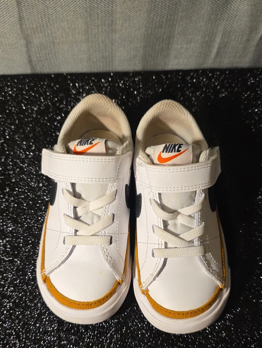 Nike Kids White Sneakers with Orange and Black Accents